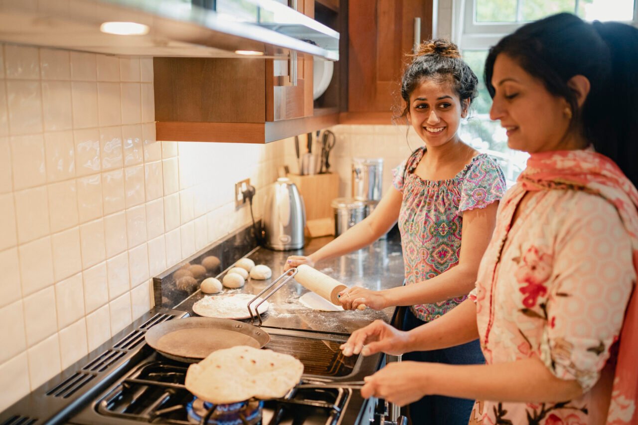 Two women baking bread together